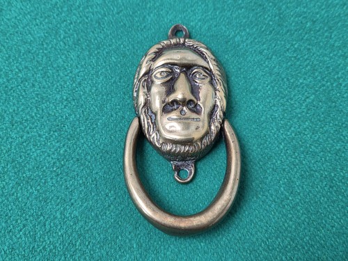 Small brass prehistoric man - brass,